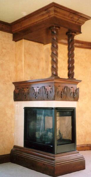 Hand carved 3 sided fireplace with carved rope twist columns