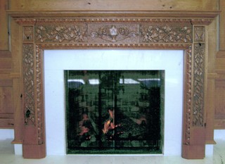 Carved mantle with leaves and vines