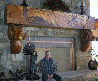 Carved bighorn sheep and scene 
