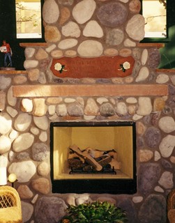 Carved stone mantle