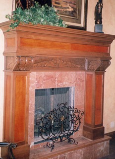 Carved mantle with leather panels, unique and one of a kind