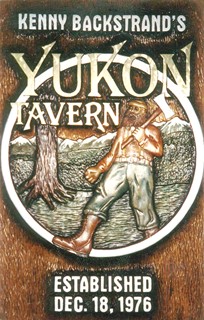 Carved Yukon Sign with Lumberjack