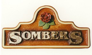 Carved sign with wild rose